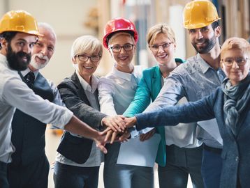 Construction team collaboration with hard hats